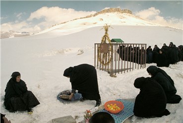Photography, Abbas Attar (Abbas), IRAN. Lorestan province. Ali Abad Village. Women mourn in the village cemetery under snow. Sweets and fruits are offered to Passerbys. , 2001, 25721